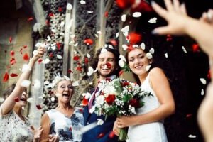 family throwing rose petals at the newly wed bride 2022 12 16 00 29 33 utc.jpg